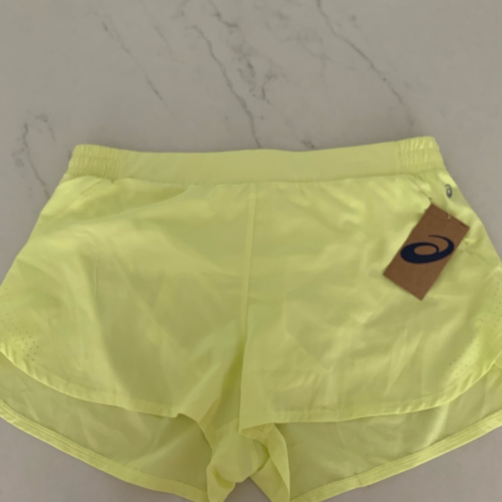 Yellow ASICS athletic shorts